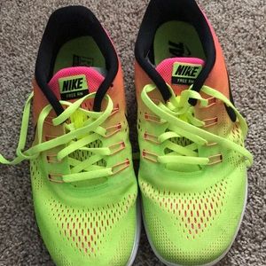 Neon tie dye Nike free RN tennis shoes